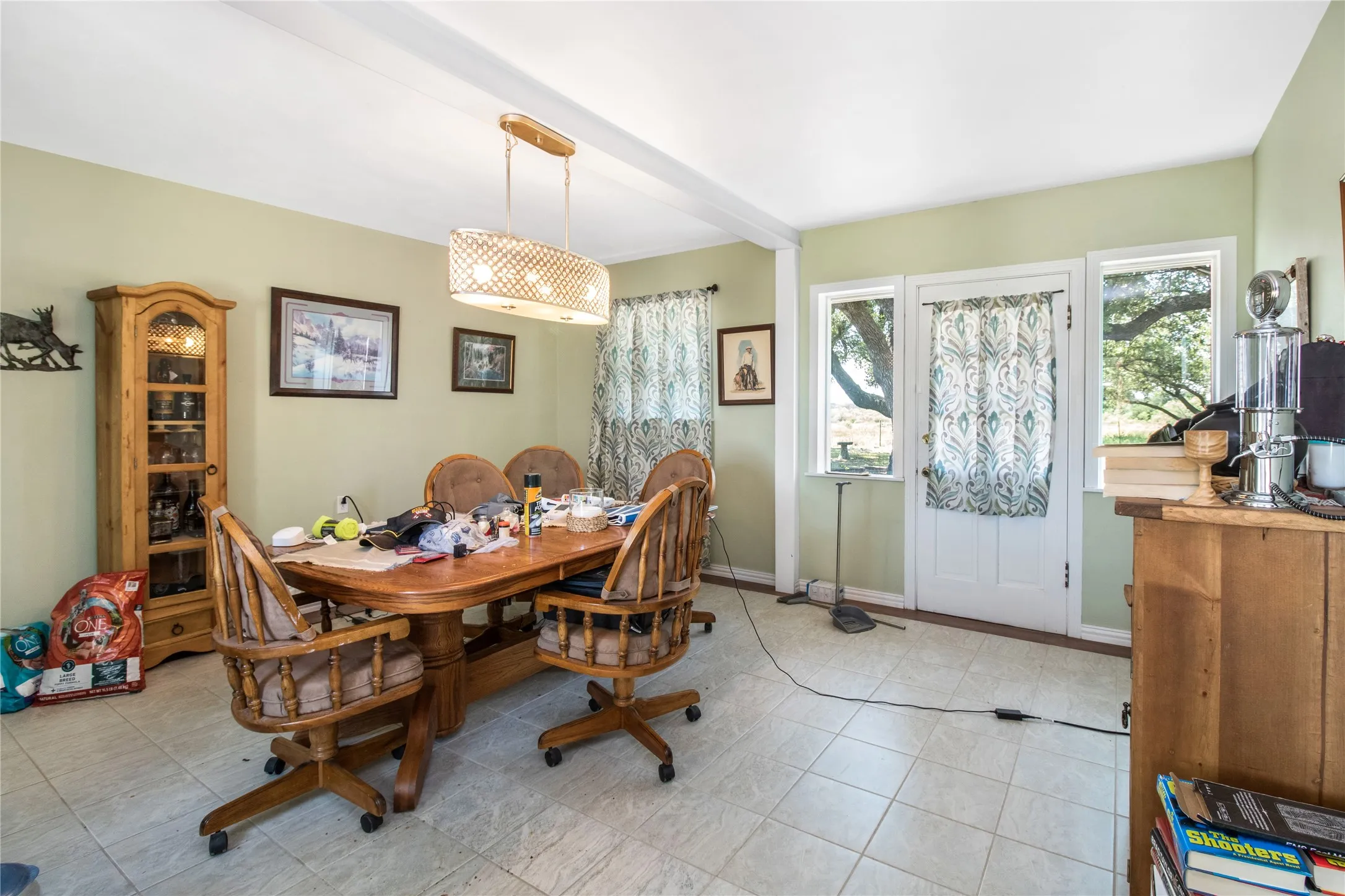Dining room featuring light tile patterned floors