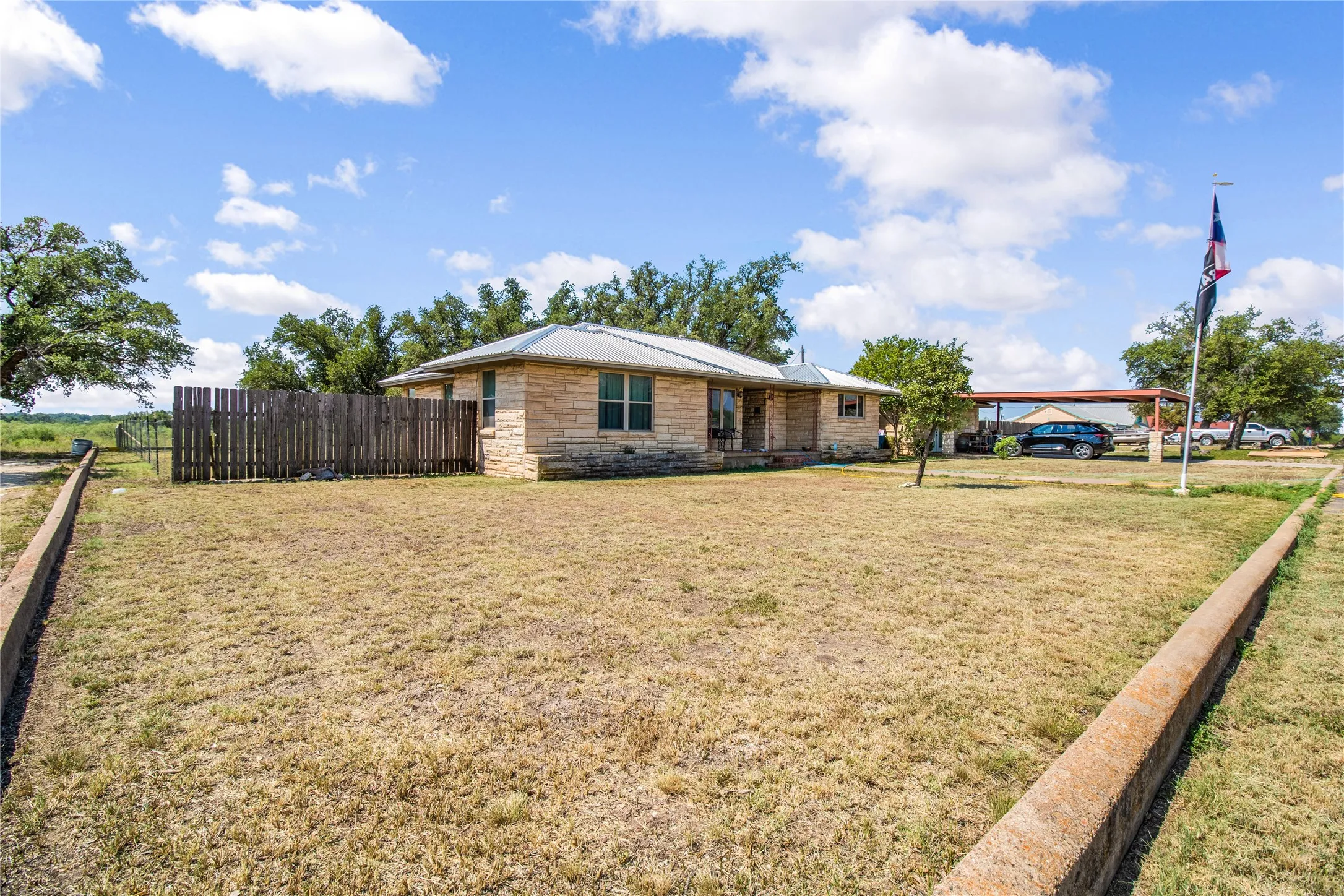 View of yard featuring a carport
