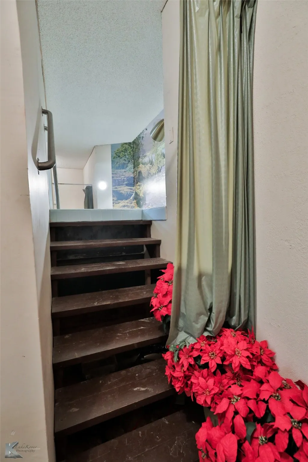 Staircase with a textured ceiling