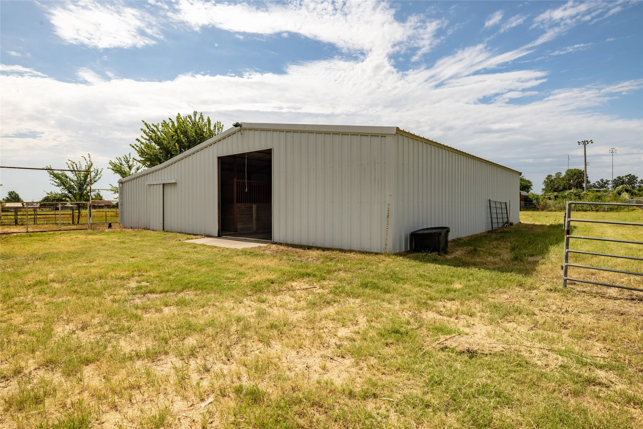View of outbuilding with a yard