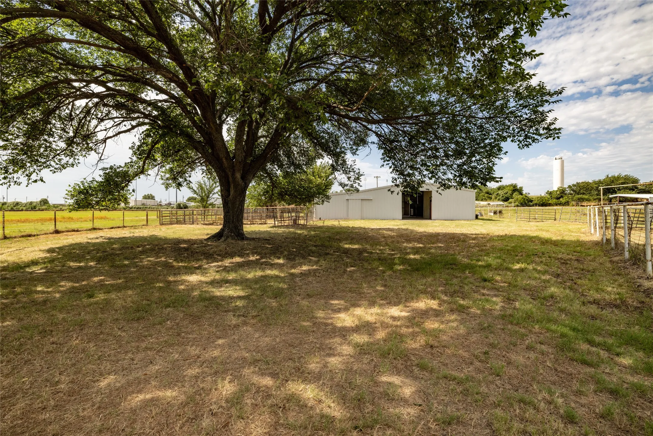 View of yard with a rural view