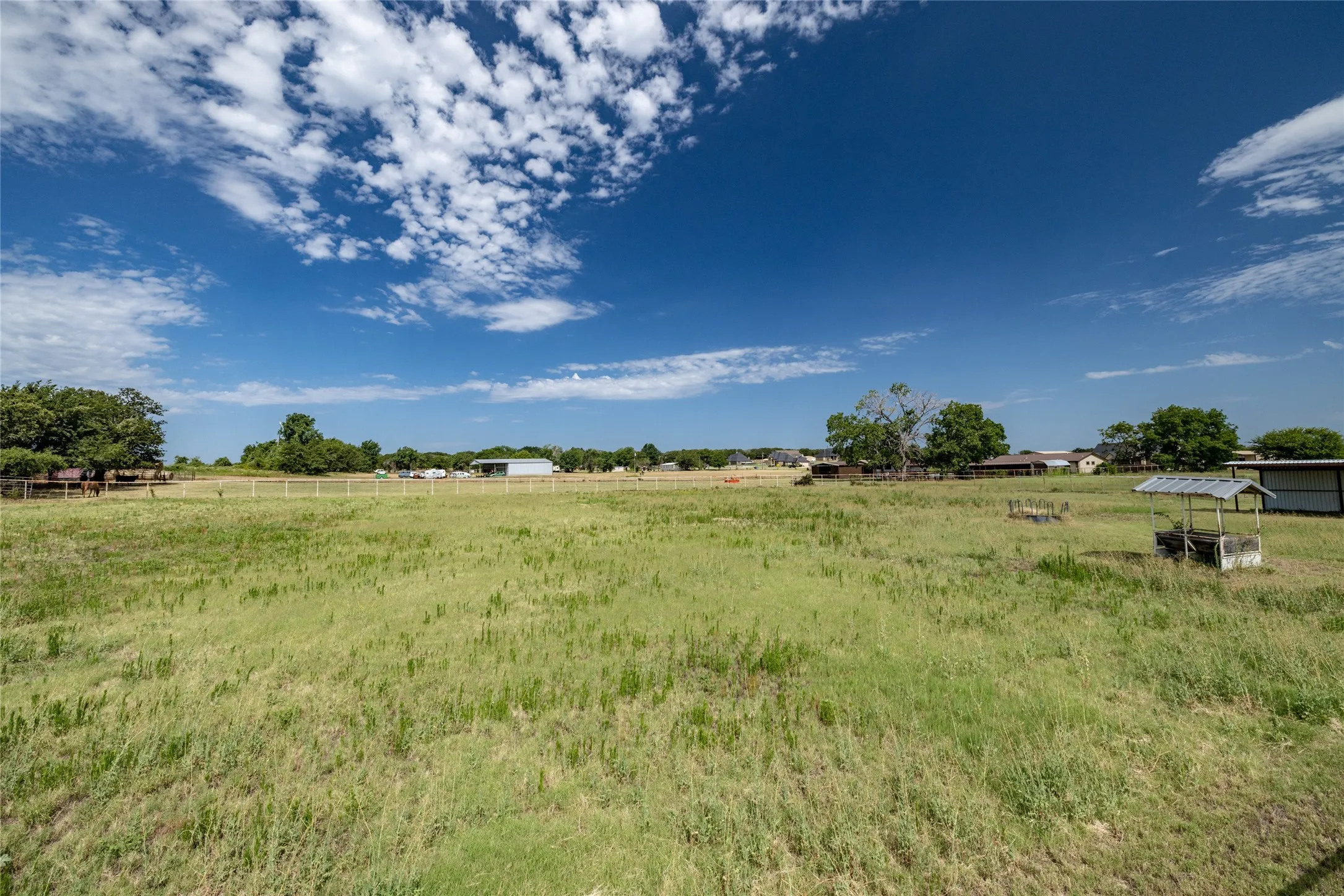 View of yard with a rural view