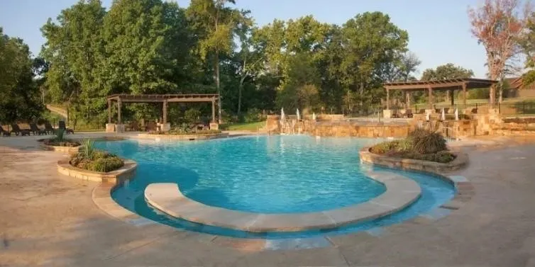 View of  community swimming pool with a pergola