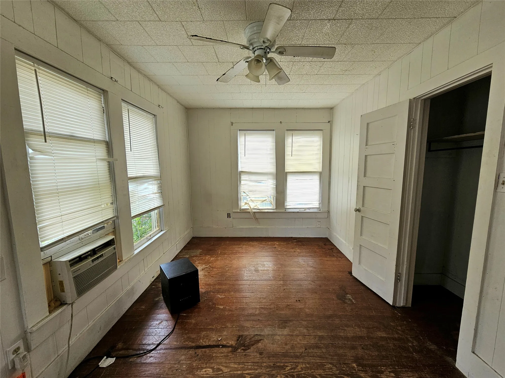 Unfurnished sunroom with cooling unit