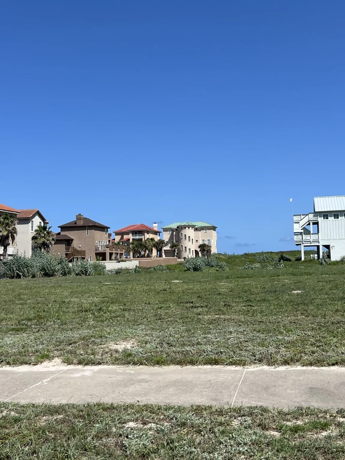 Wide greenspace to the rear for expansive views from your newly constructed custom Beach House!!