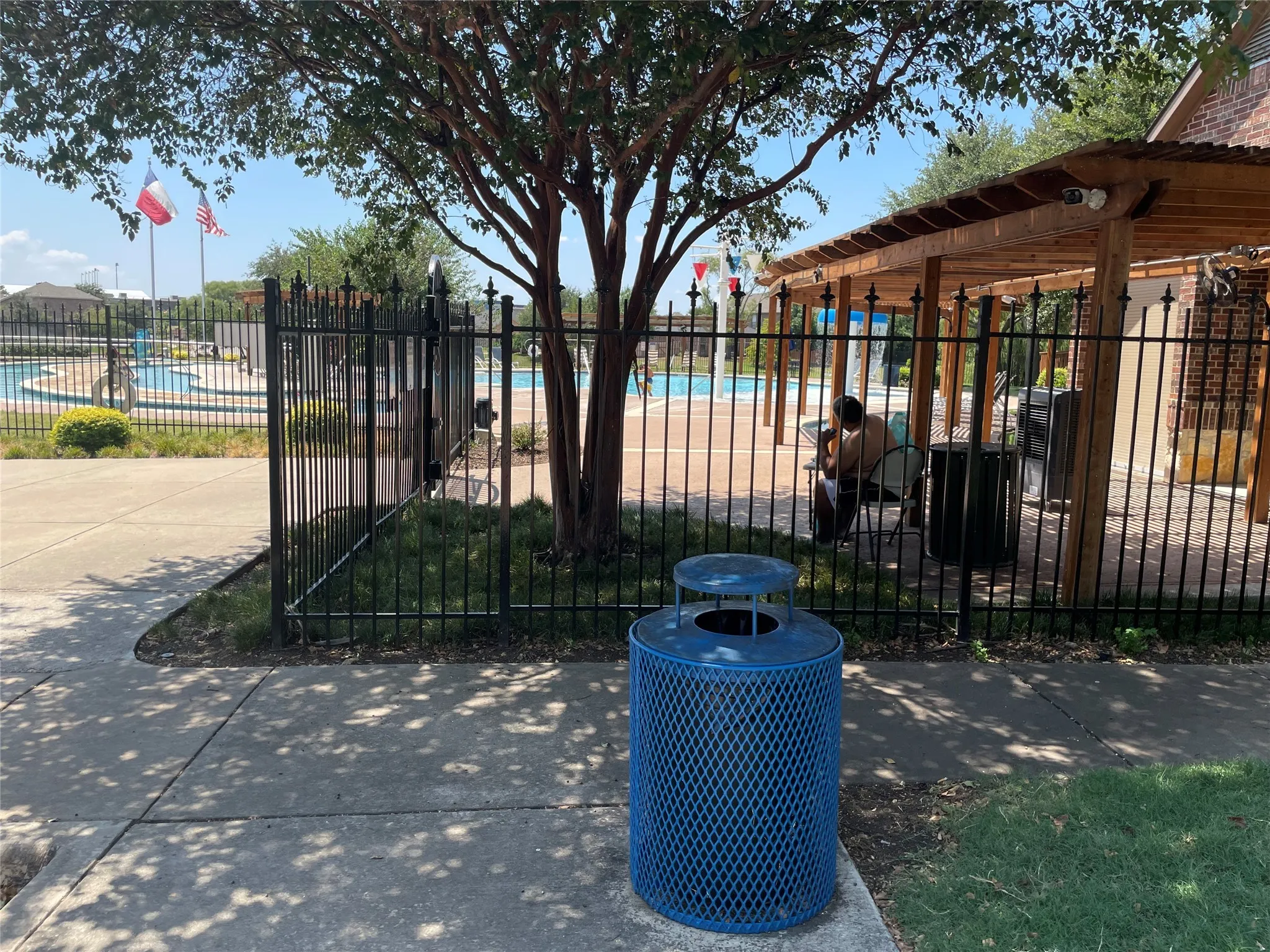 View of gate featuring a community pool