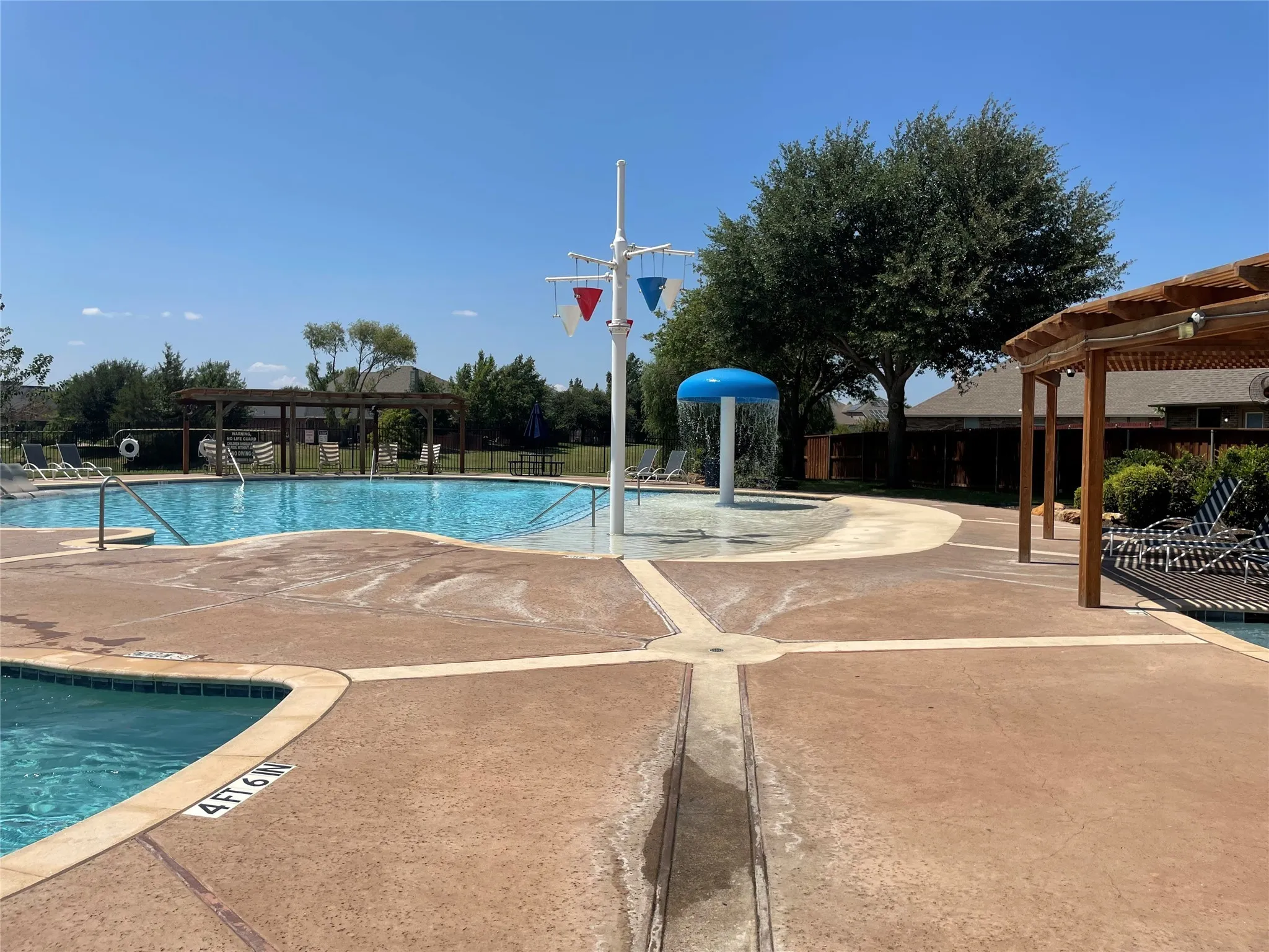 View of swimming pool featuring a pergola and a patio