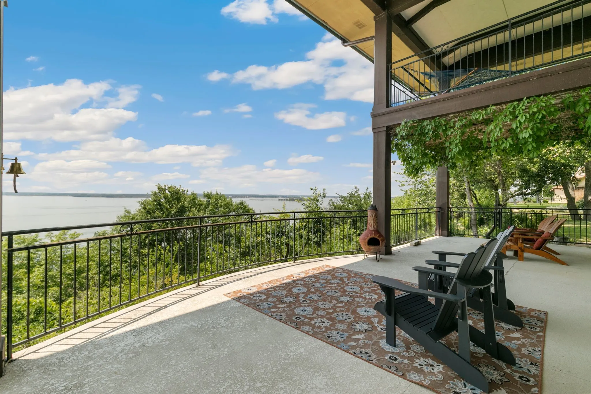 View of patio / terrace featuring a water view and a balcony
