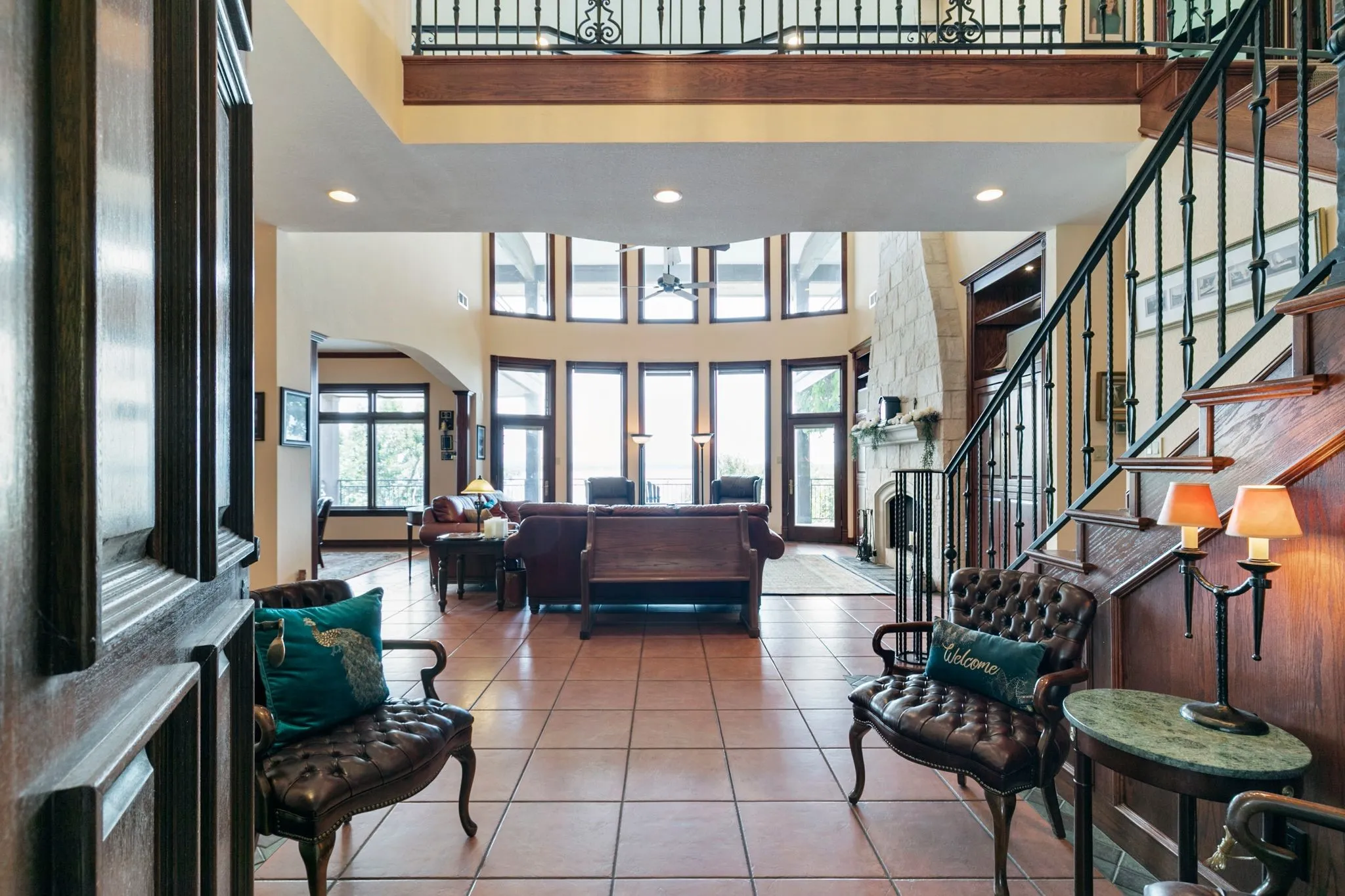 Tiled entrance foyer with a towering ceiling