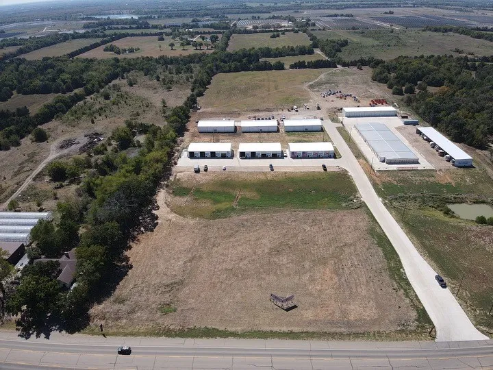 Birds eye view of property featuring a rural view