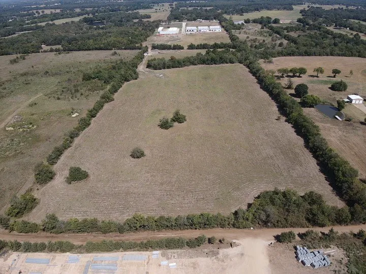 Birds eye view of property featuring a rural view