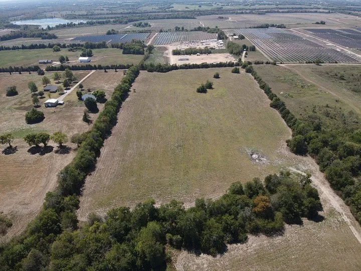Drone / aerial view featuring a water view and a rural view