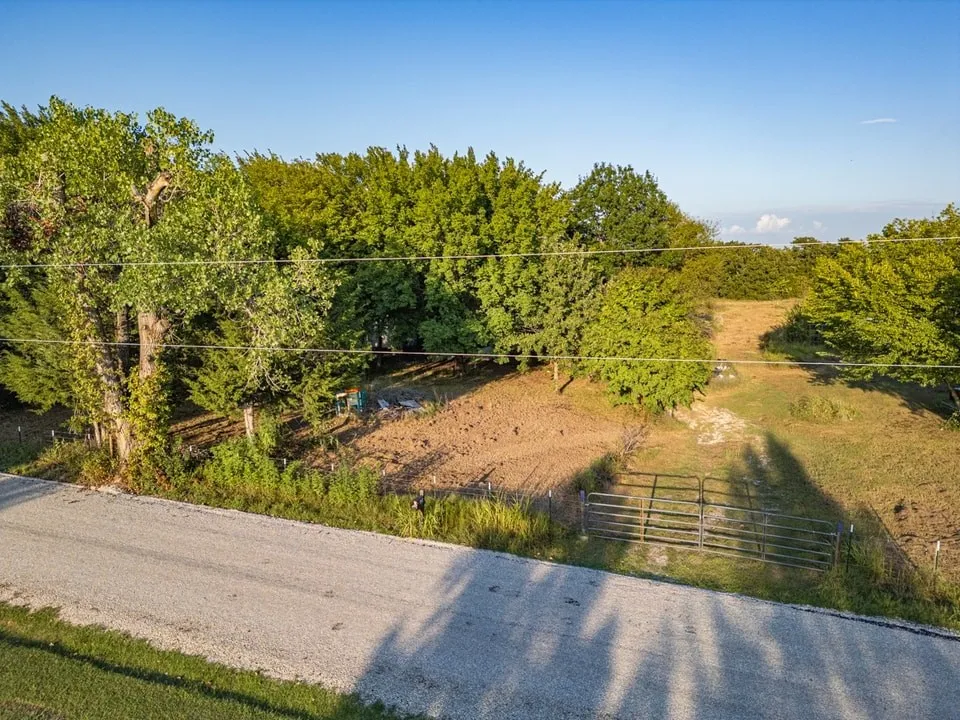 Birds eye view of property with a rural view