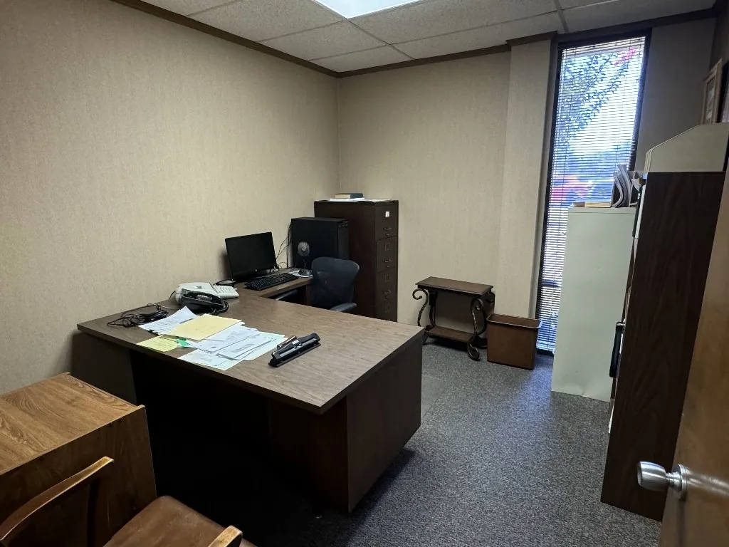 Office space with a paneled ceiling