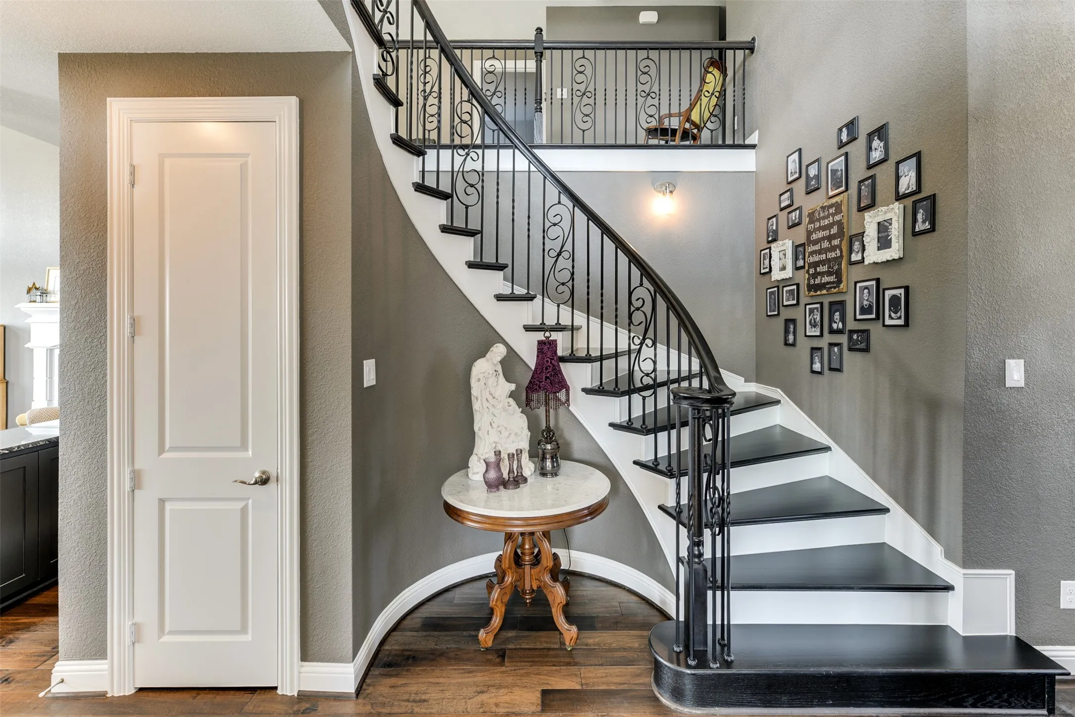 Stairway featuring hardwood / wood-style flooring