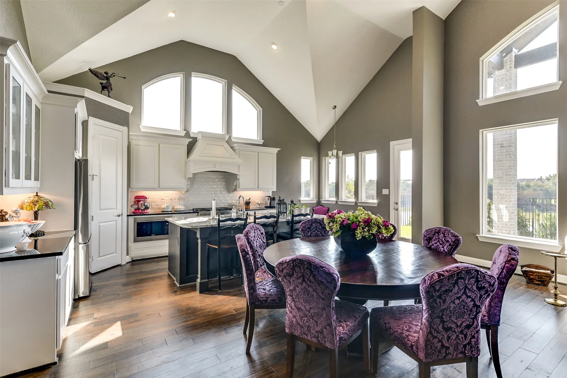View from family room and bar area to the kitchen.  Many windows, beautiful views
