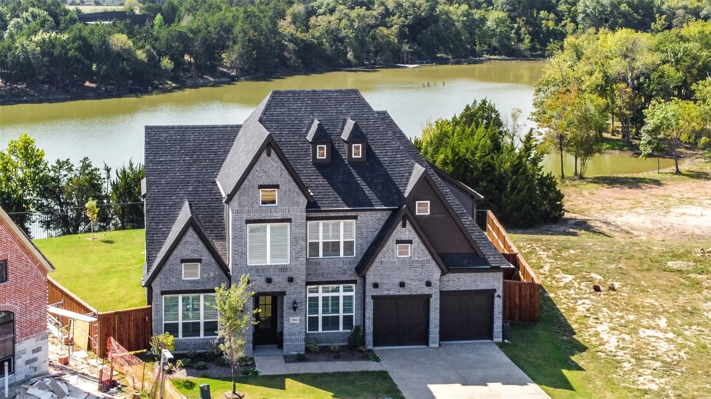 View of front of house featuring a water view and a front yard