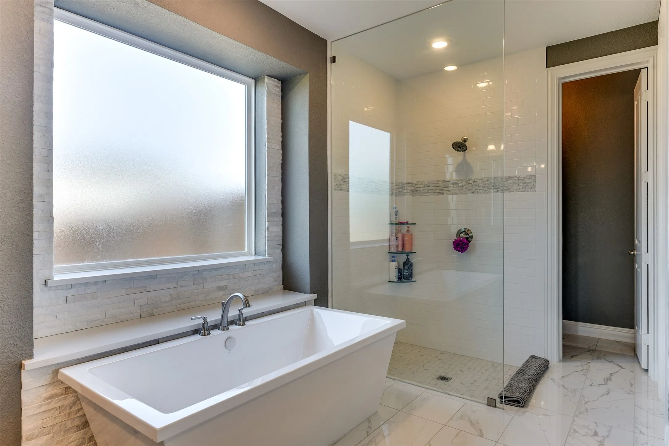 Bathroom with independent shower and bath.  Lots of natural light.  Private water closet