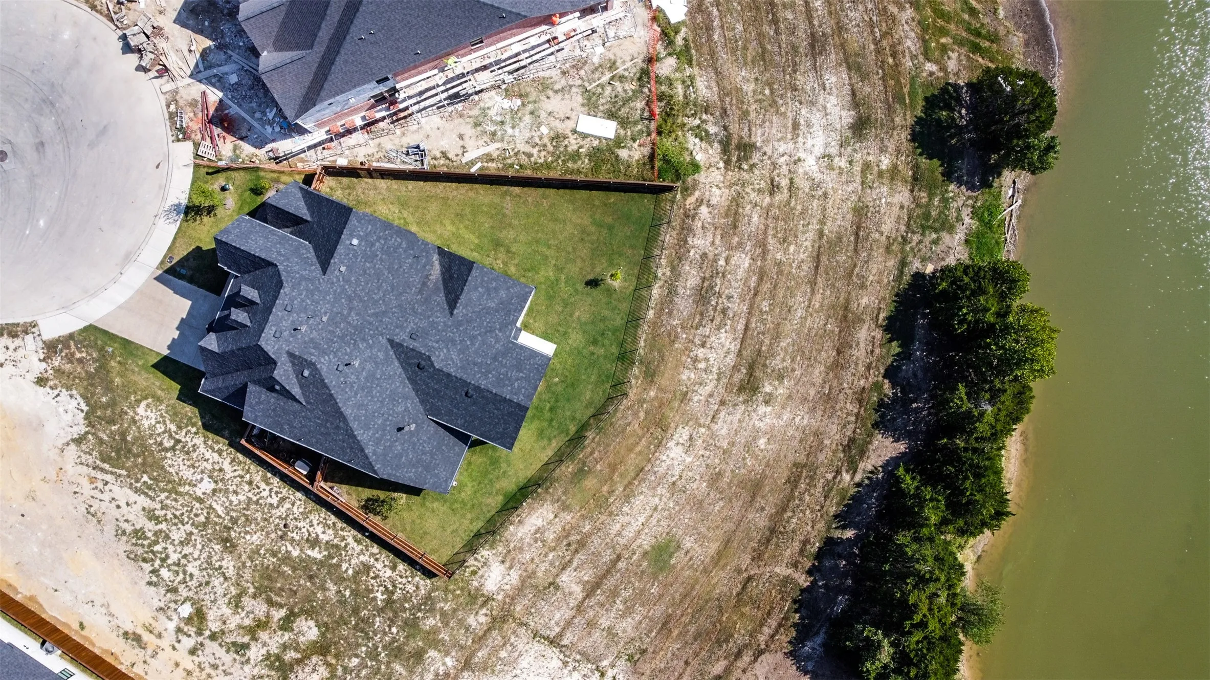 Bird's eye view with a water view, on a cup-de sac.  Property line is down to the water.
