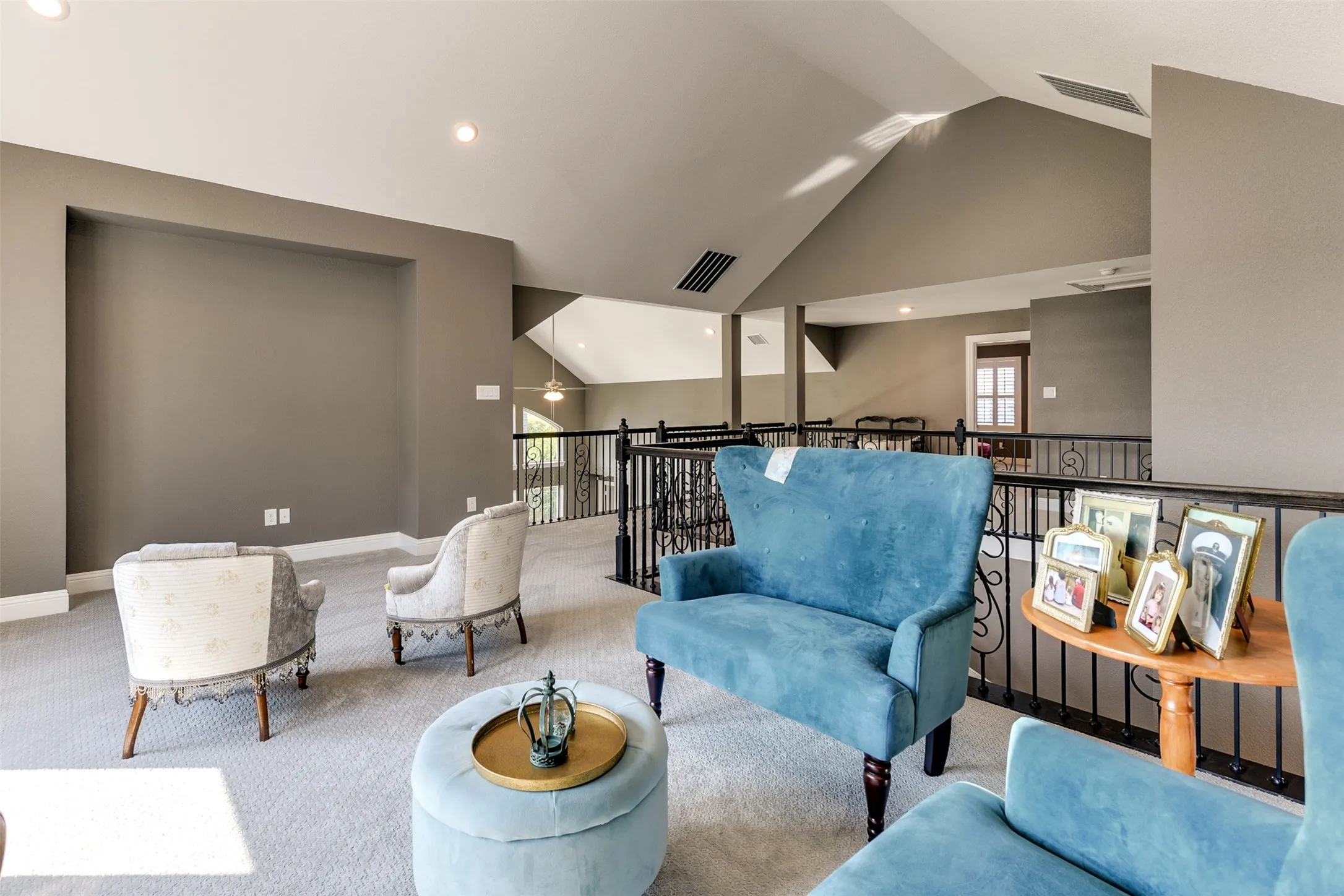 Living room featuring light carpet and vaulted ceiling