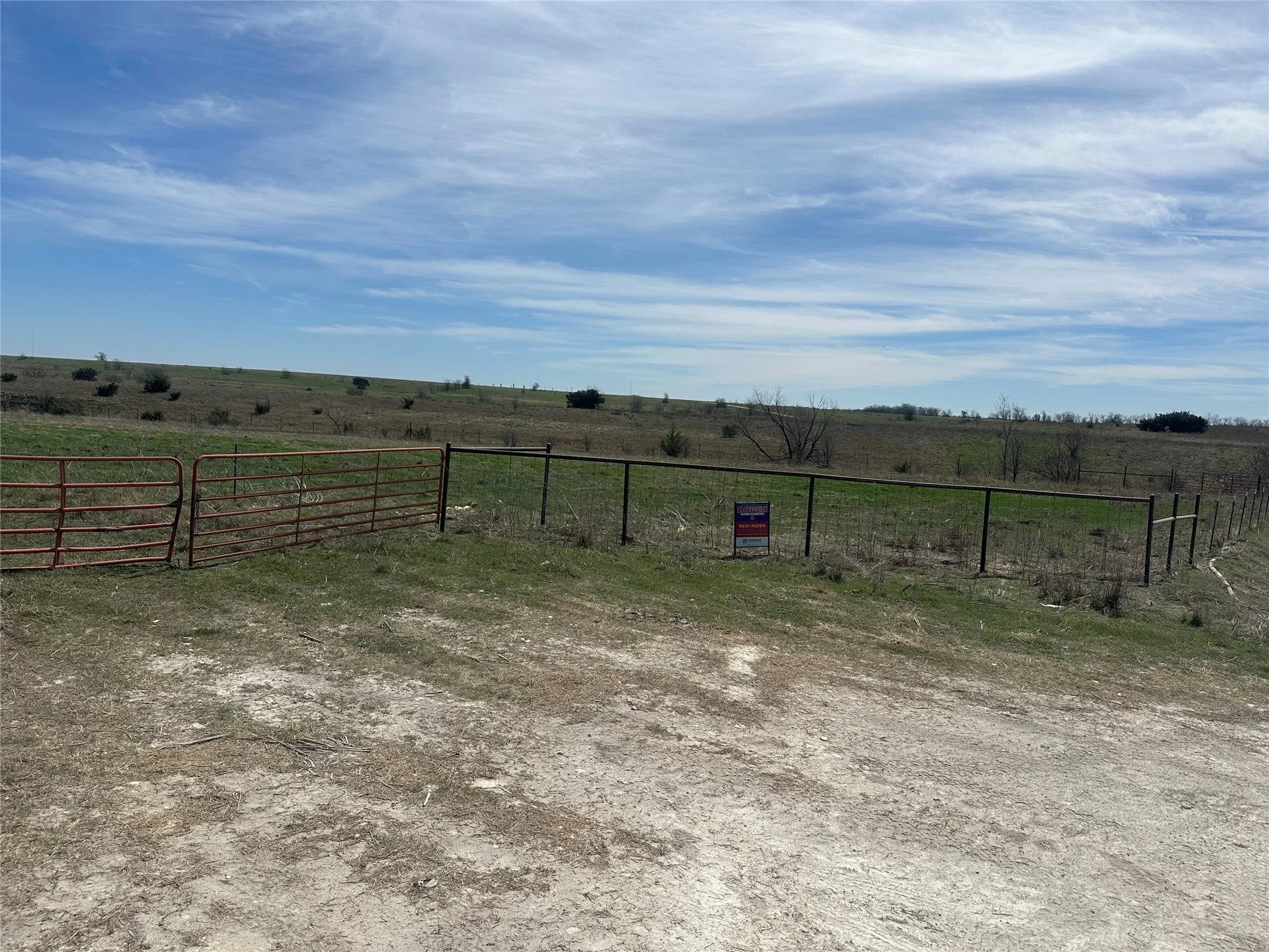View of yard featuring a rural view and fence
