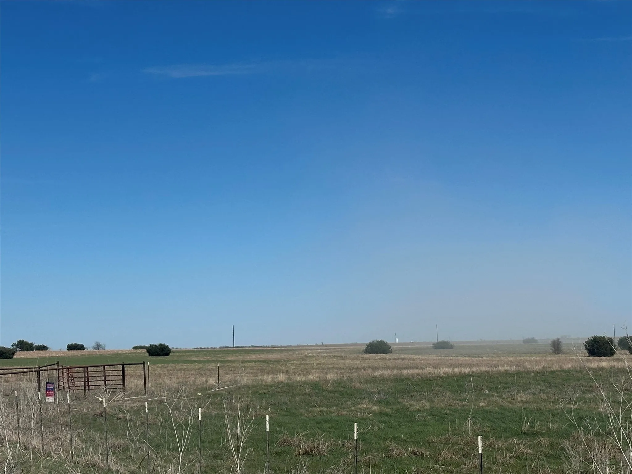 View of yard with a rural view