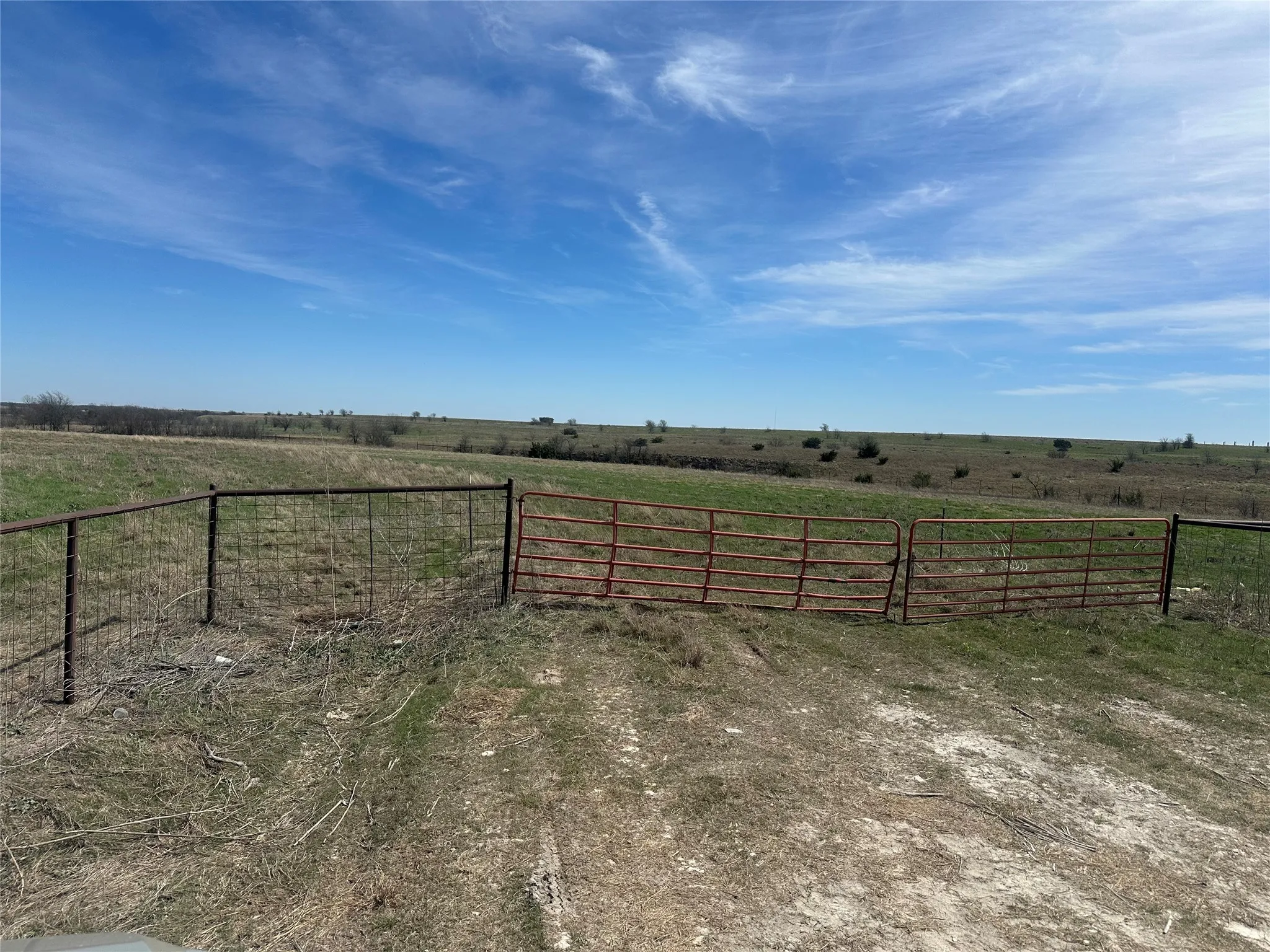 View of yard featuring a rural view and fence