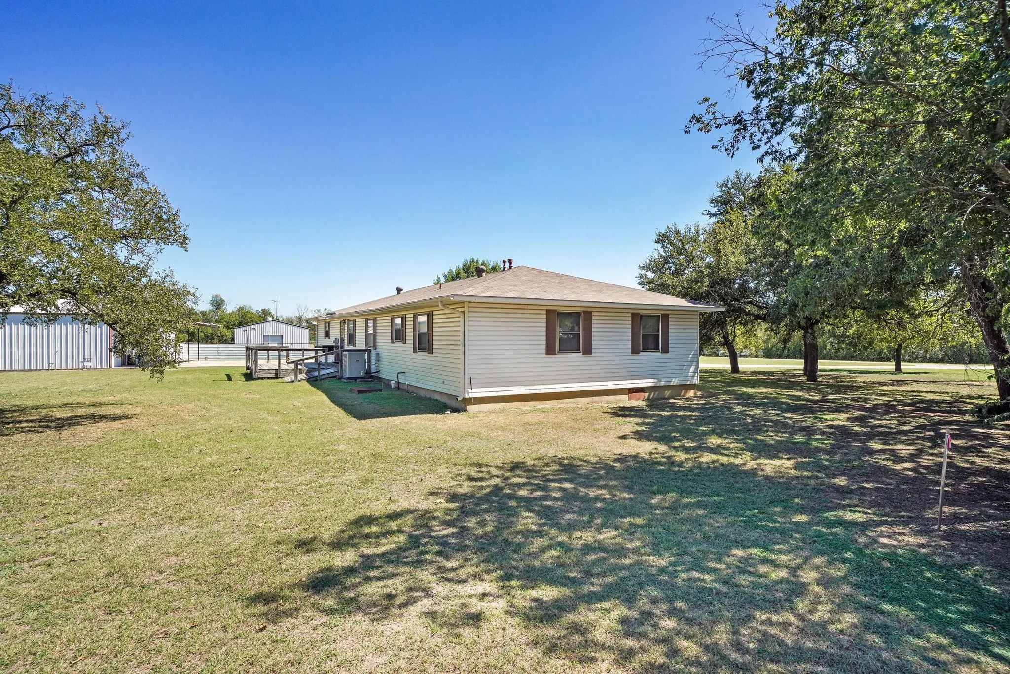 Rear view of house featuring a lawn