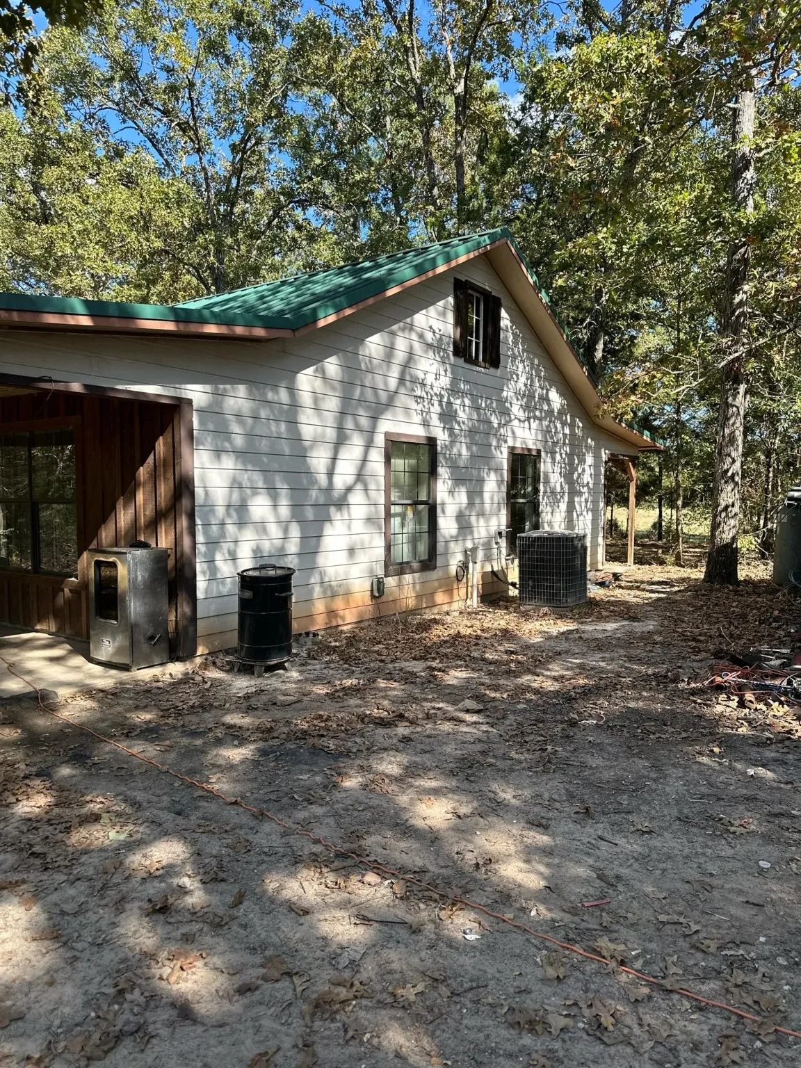 View of side of home featuring central AC unit