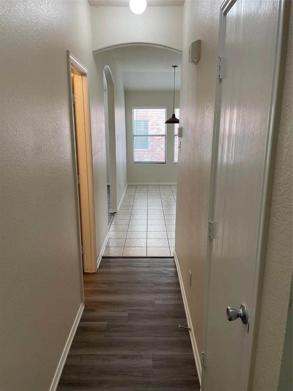 Hallway featuring dark hardwood / wood-style flooring