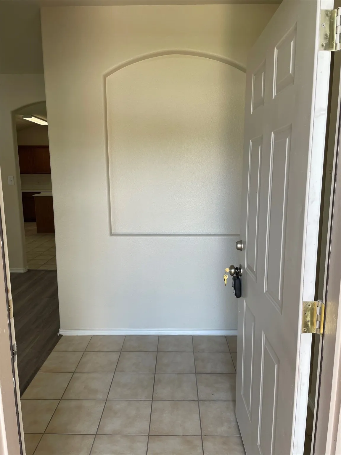 Washroom with light tile patterned floors