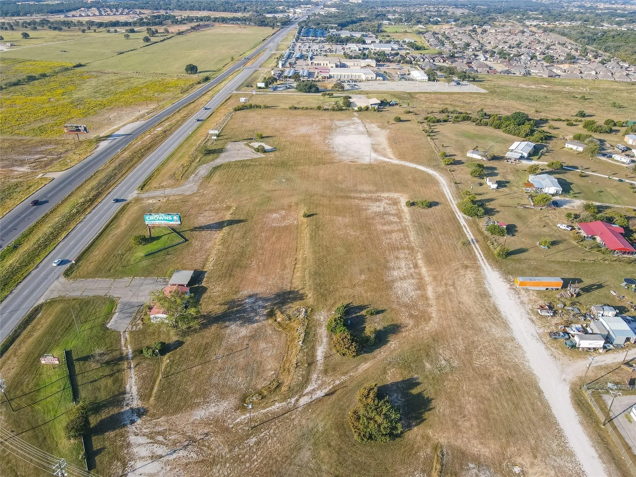 Birds eye view of property with a rural view