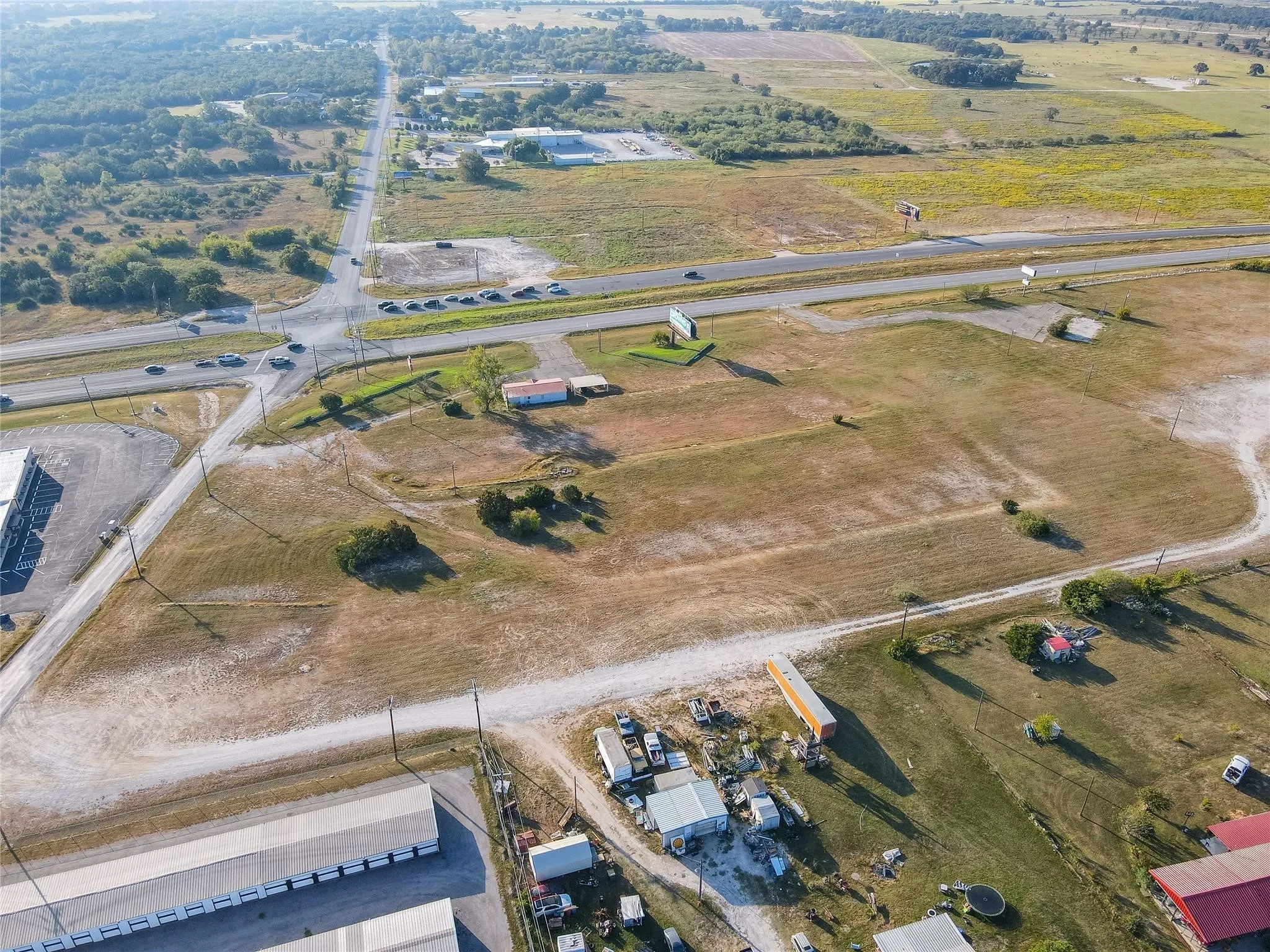 Birds eye view of property featuring a rural view