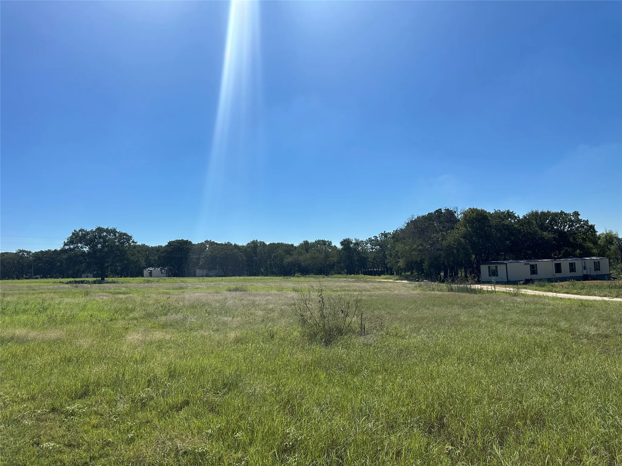 View of yard with a rural view