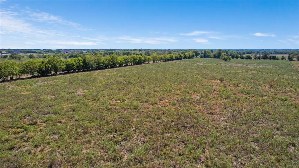 Birds eye view of property with a rural view