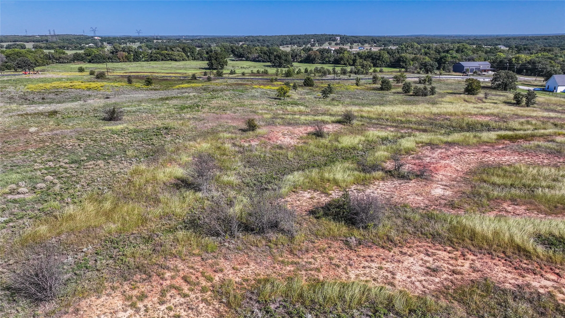 Birds eye view of property featuring a rural view