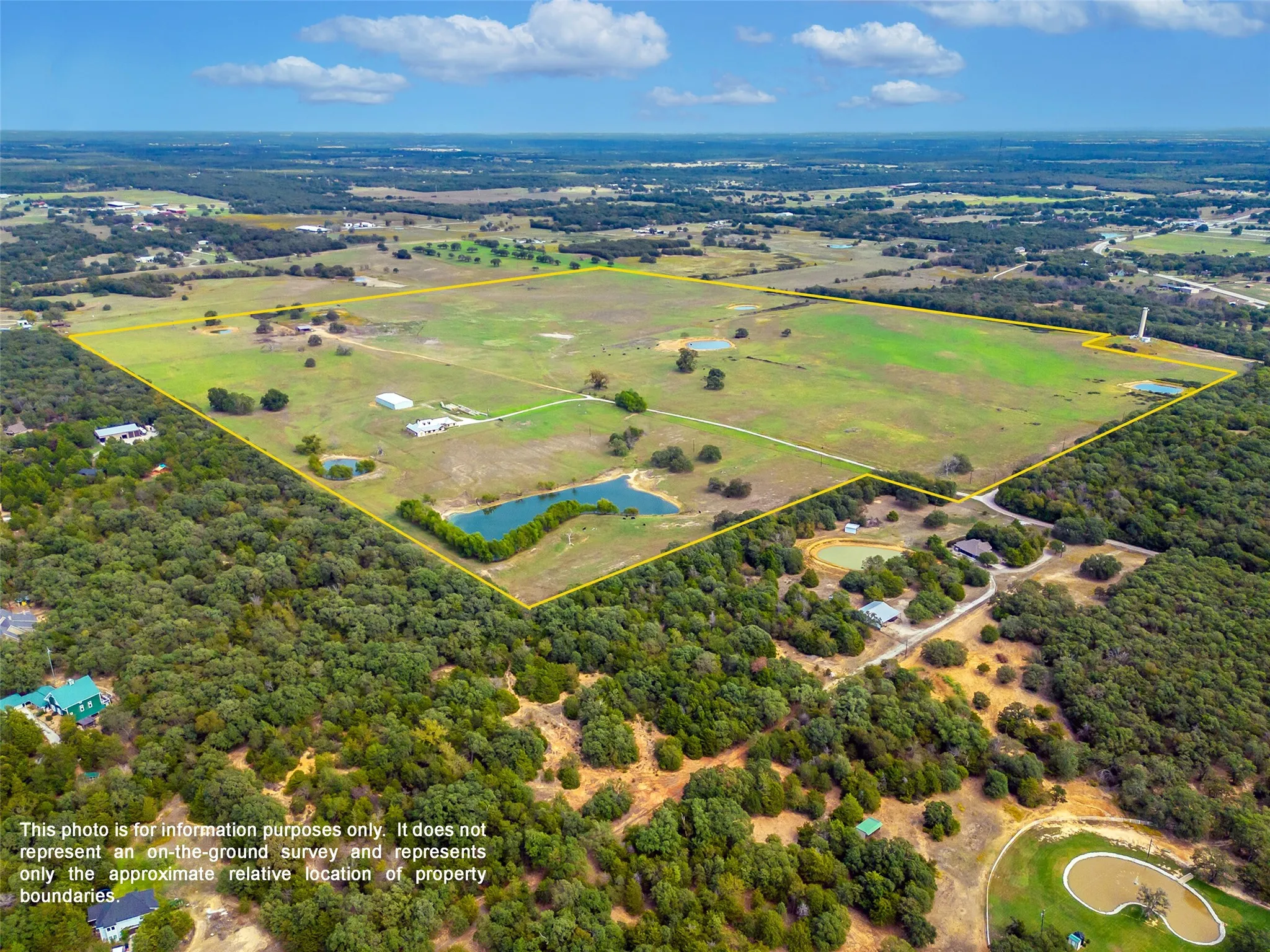 FRONT AND SIDE PROPERTY AERIAL...Outlines Are Approximate