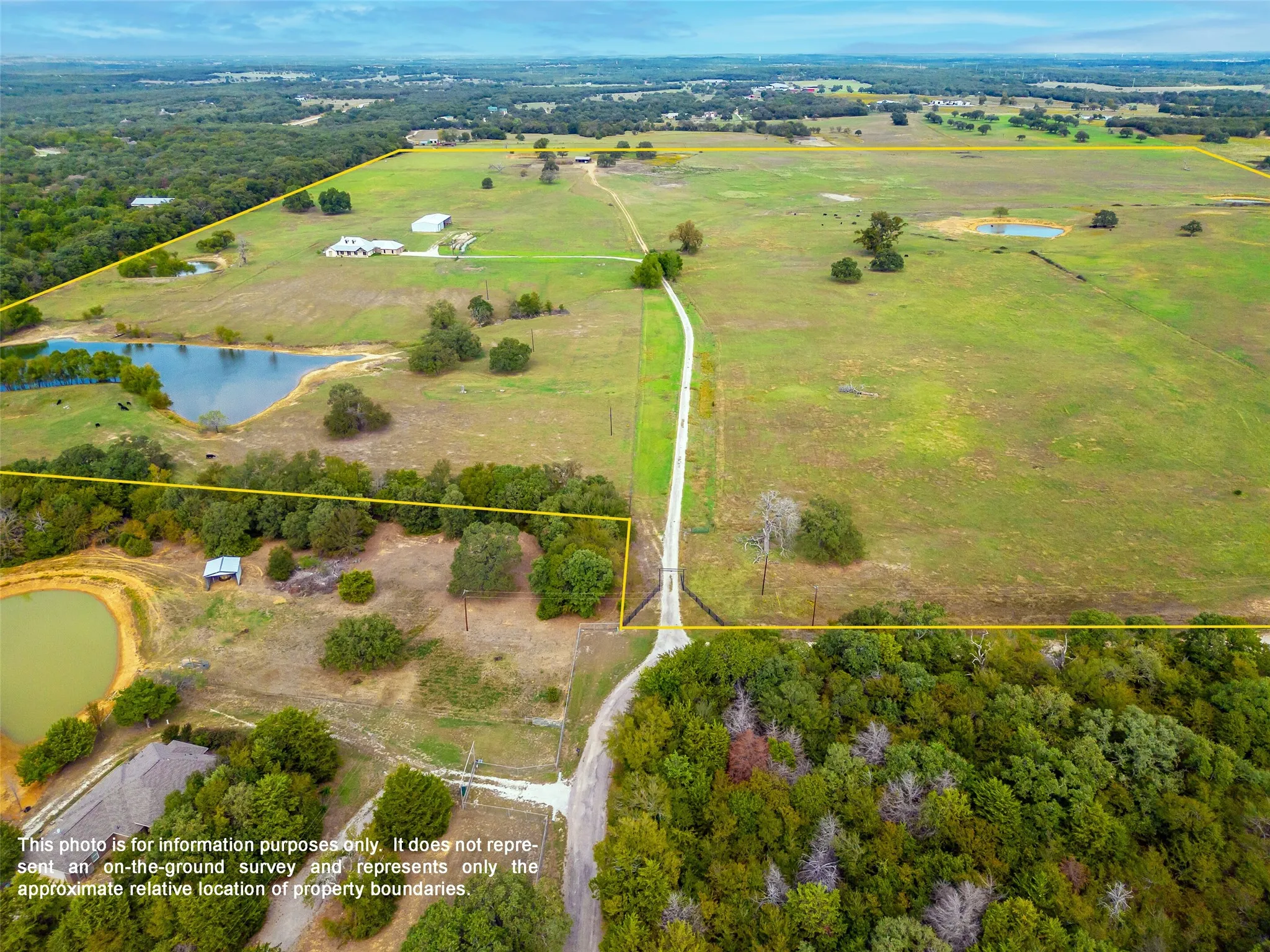 FRONT OF PROPERTY AERIAL...Extra View, Long Driveway With Pastures On Each Side
