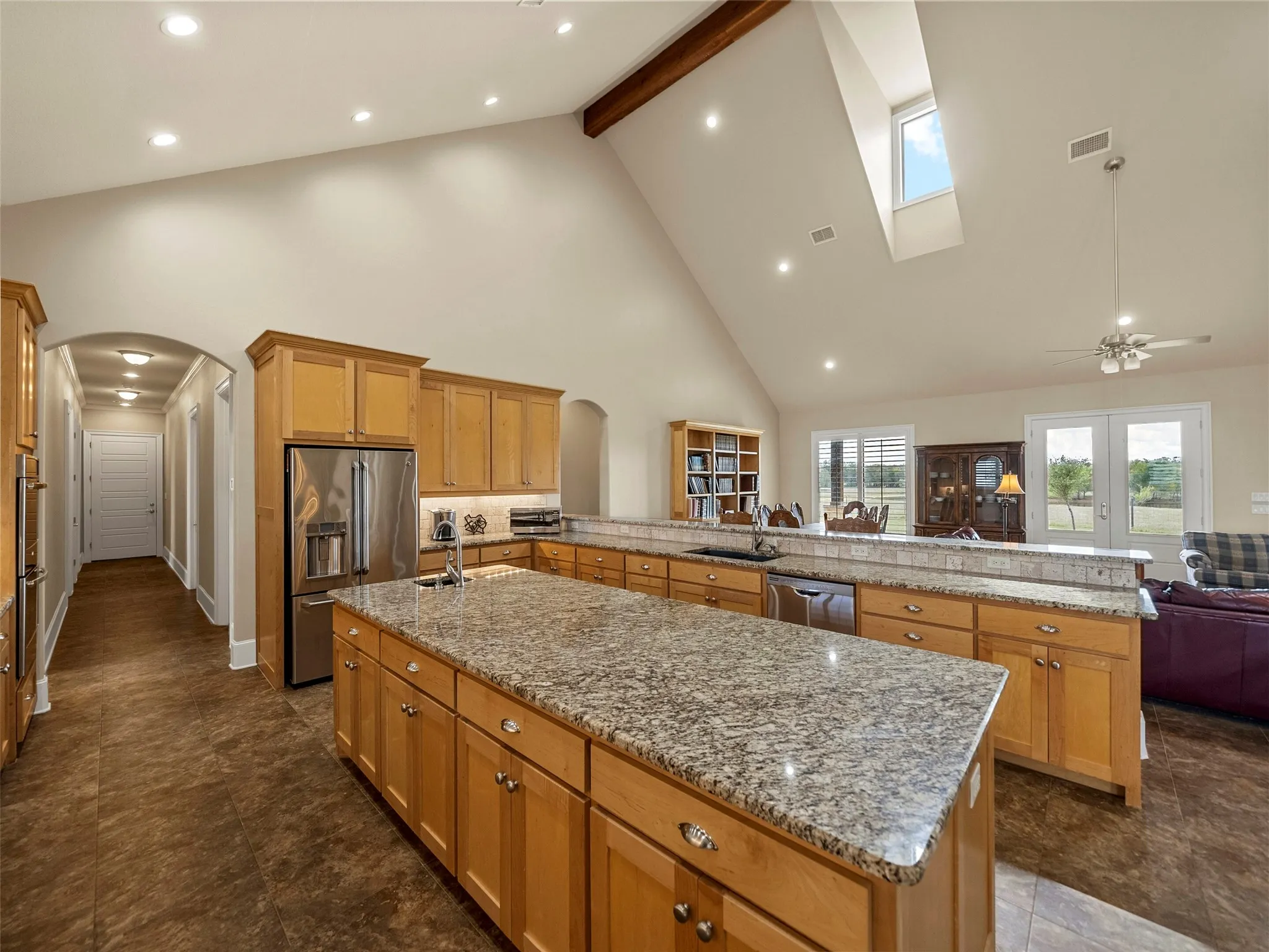 KITCHEN...Island W/Built-Ins, Large Breakfast Bar, Open To Living And Dining Areas