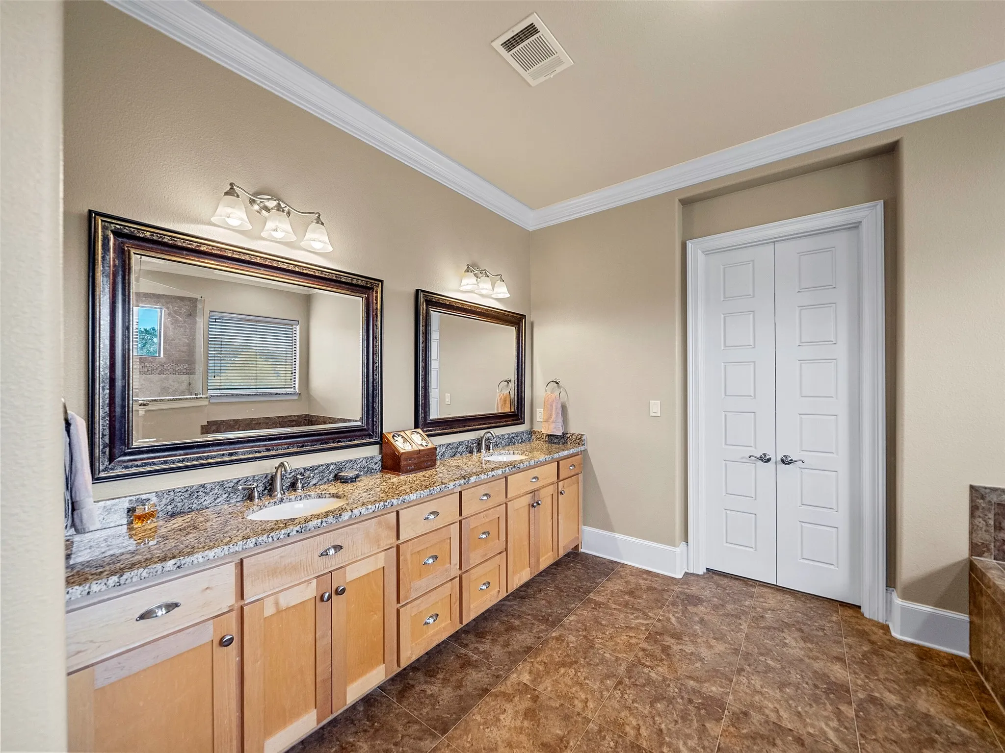 PRIMARY BATHROOM...Tile Floor, Dbl Vanity W/Granite Top, Walk-In Closet W/Built-Ins