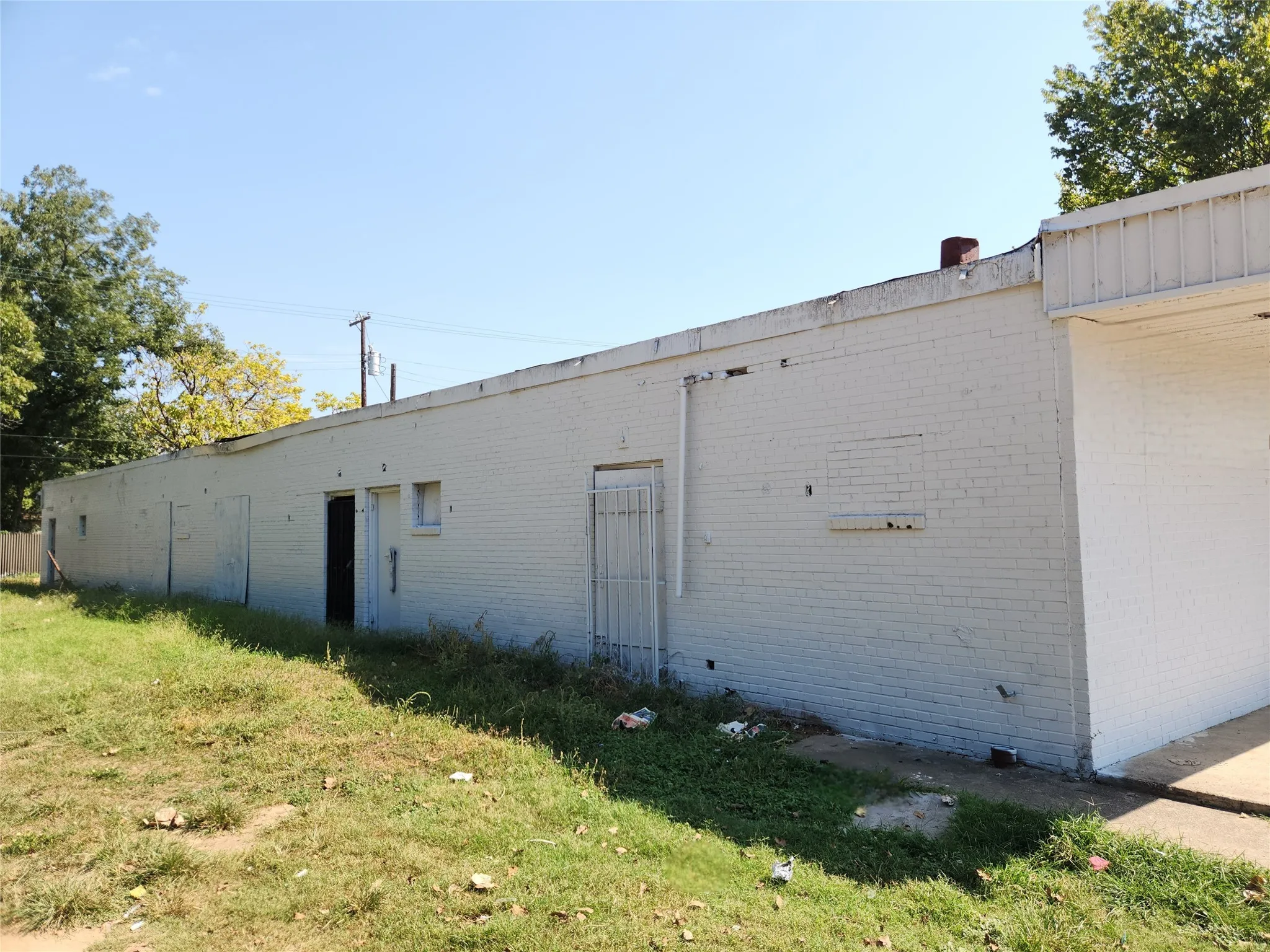 View of outbuilding with a yard