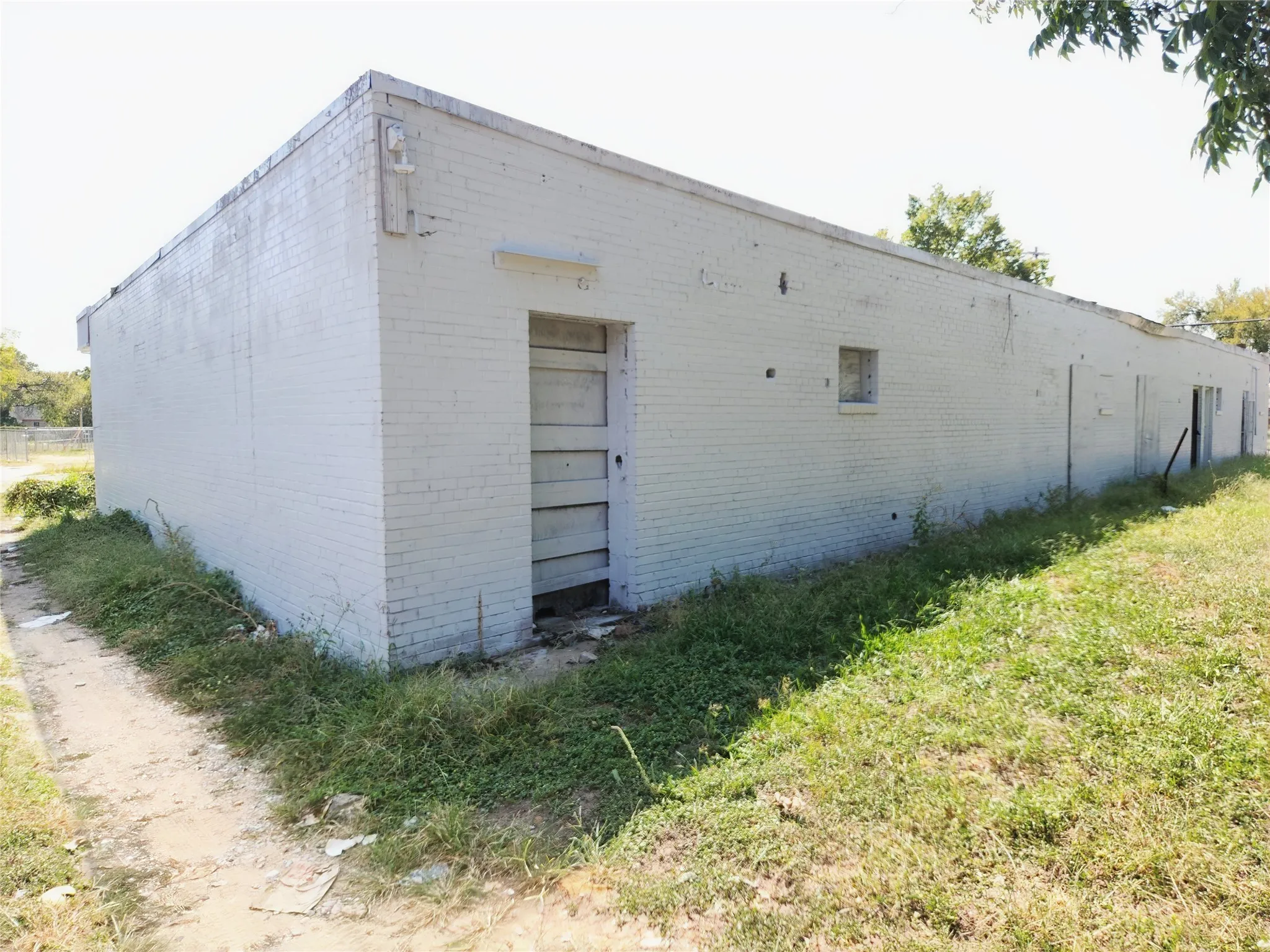 View of side of property featuring a lawn