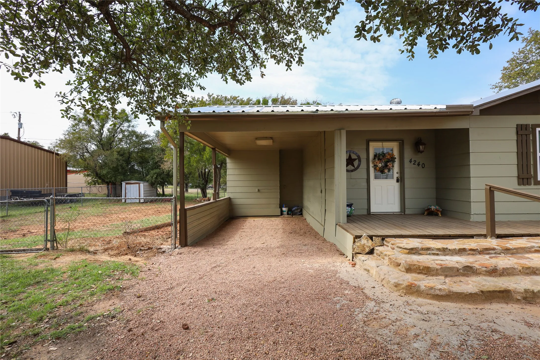 View of front of home with a shed