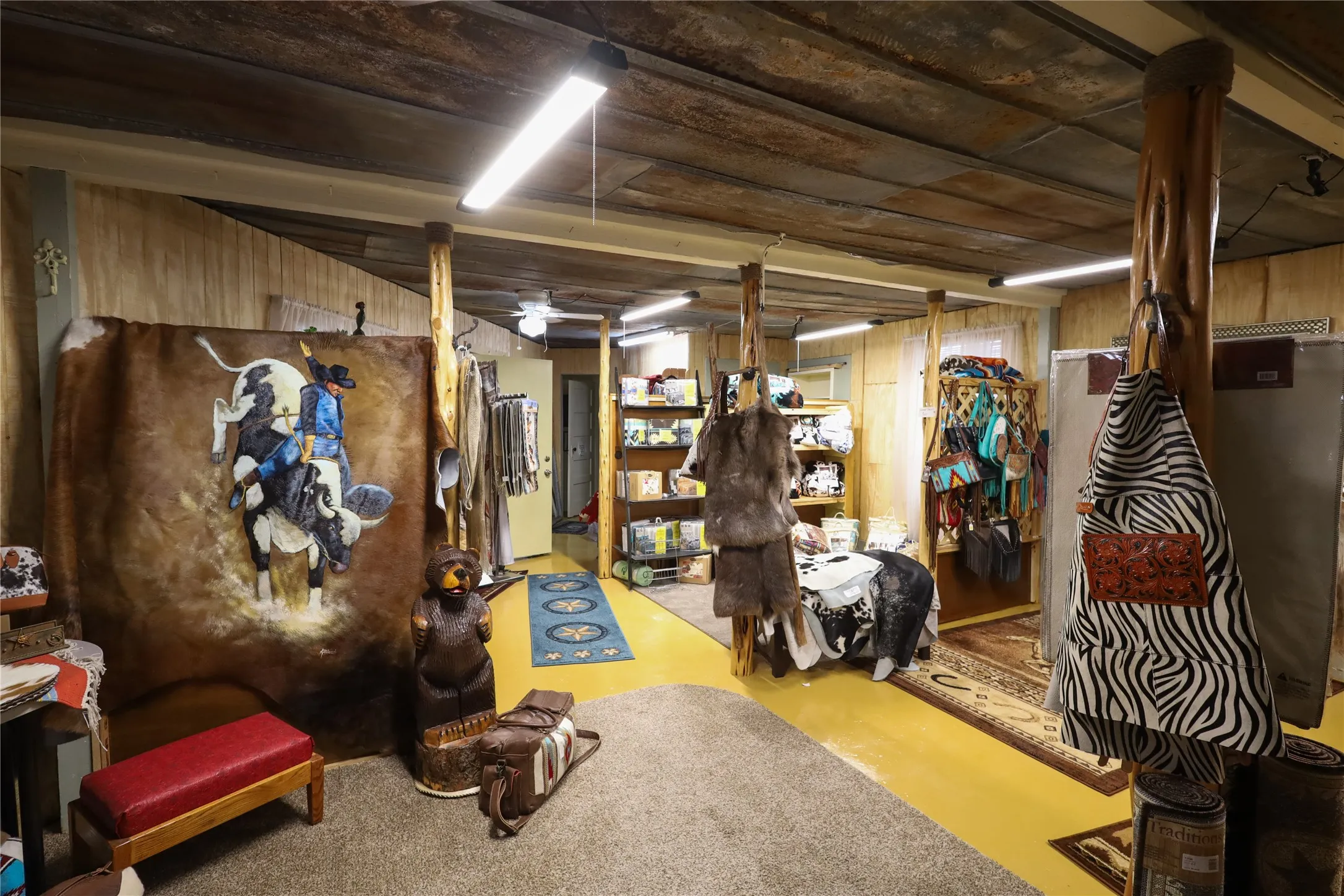 Basement with wooden walls and ceiling fan