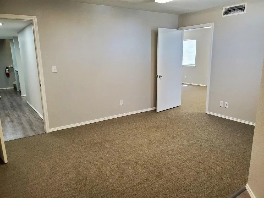 Spare room featuring carpet flooring