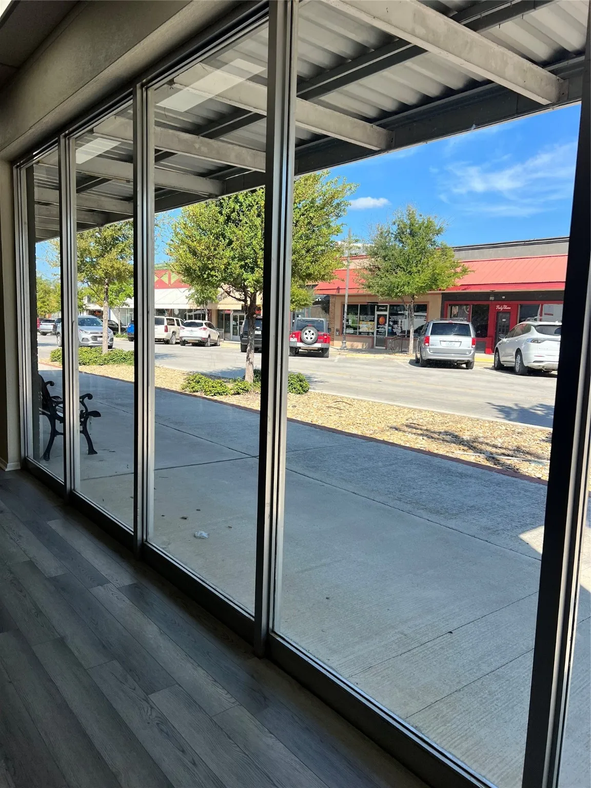 Doorway to outside with dark wood-type flooring