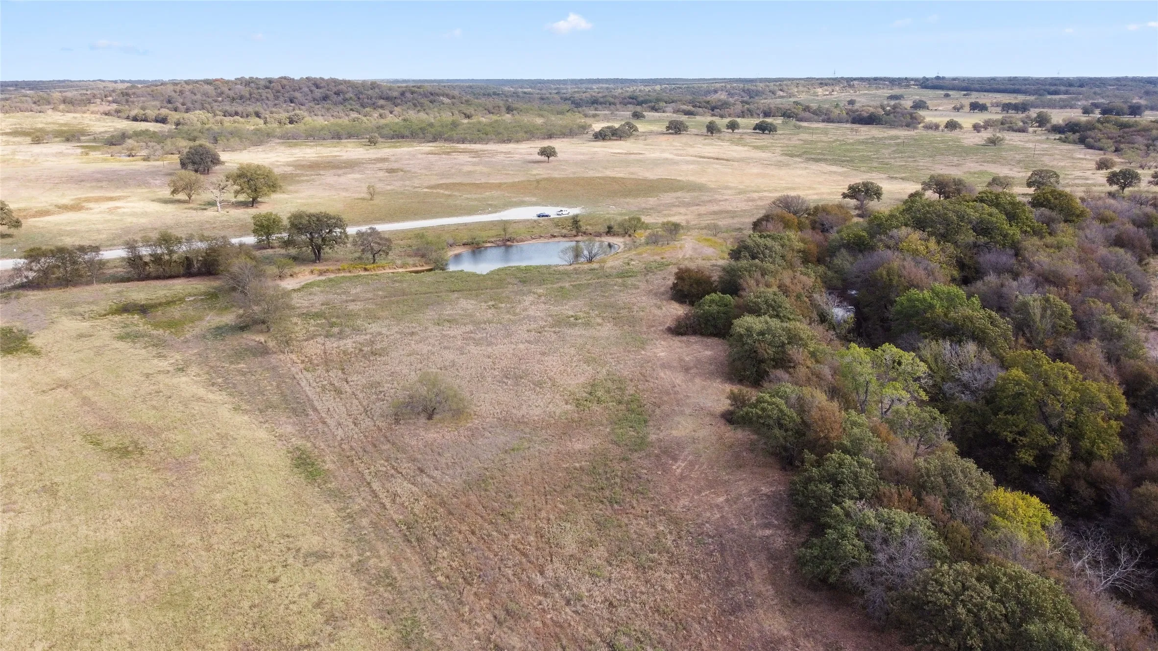 Drone / aerial view featuring a water view and a rural view