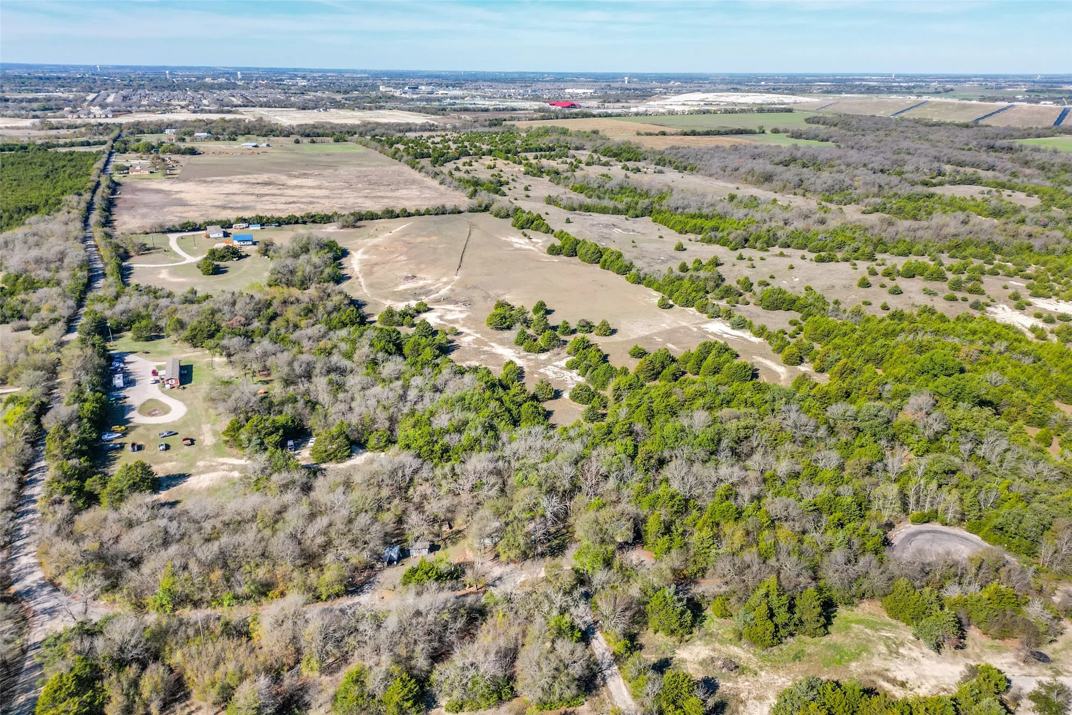 Aerial view from east end of property looking westward showing additional road frontage on east side.