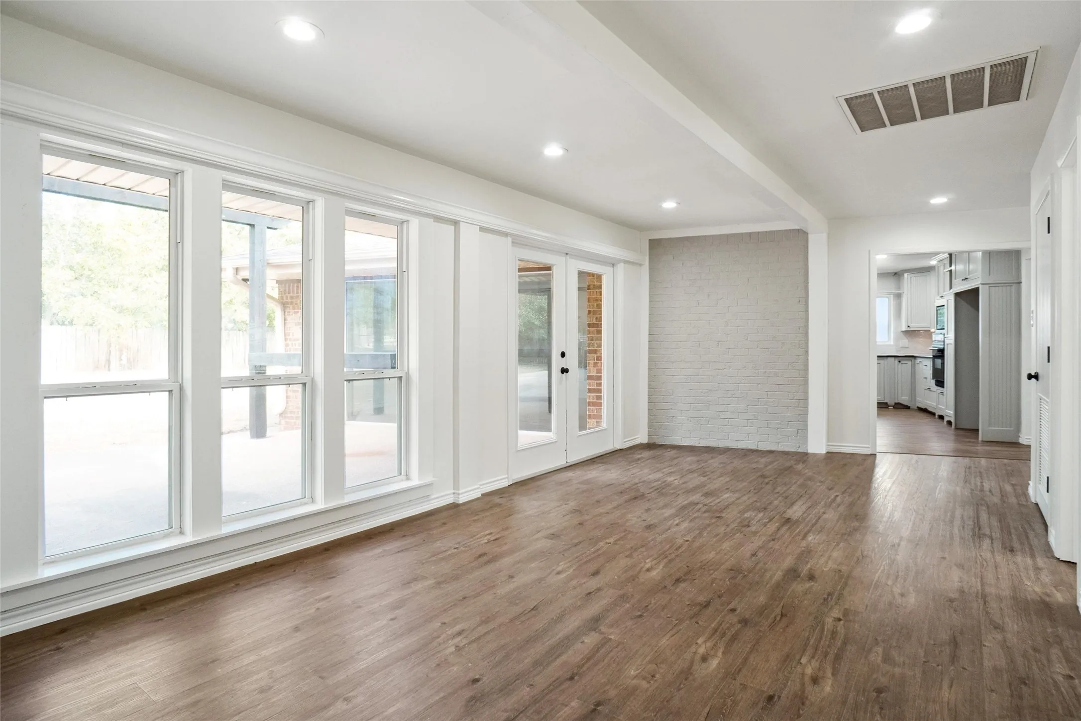 Unfurnished living room featuring dark hardwood / wood-style floors