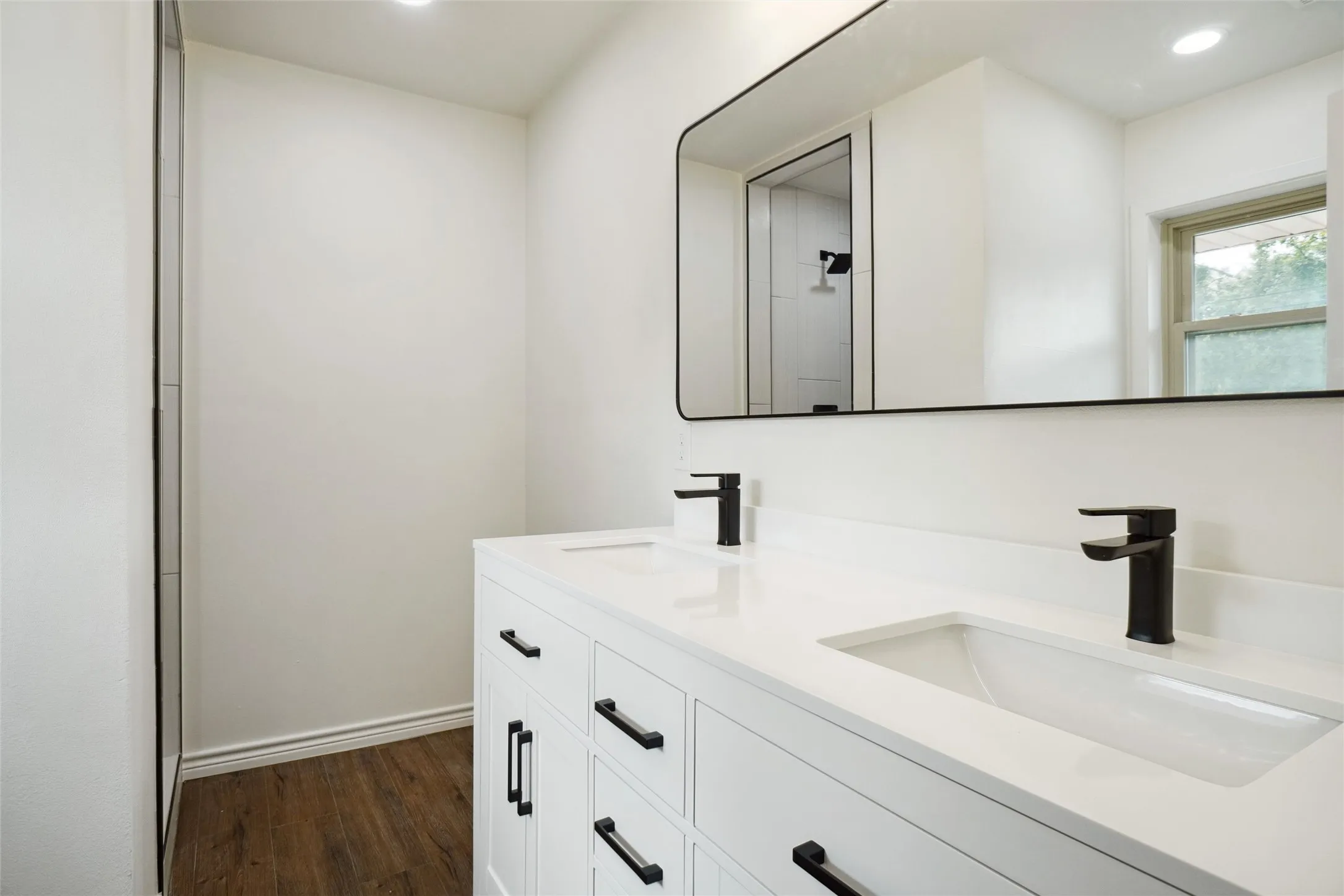 Bathroom featuring wood-type flooring and vanity